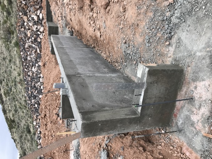 A poured structural concrete wall